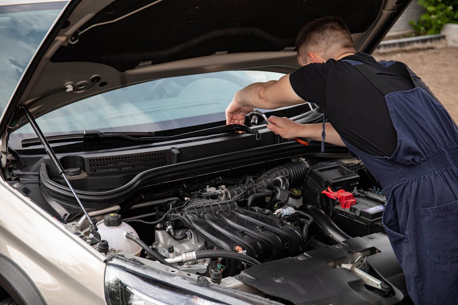 Mechanic performing professional tire installation using an impact wrench